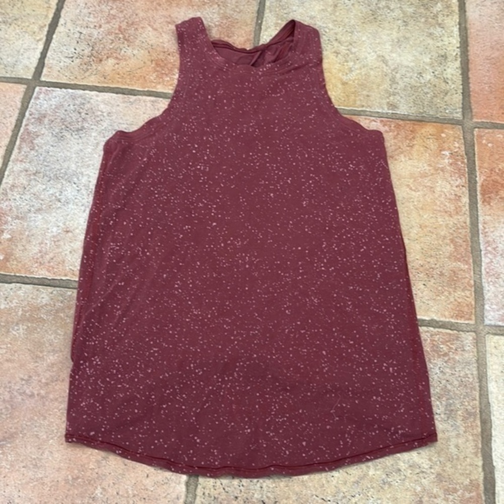 Lululemon open tie, black tank top, splattered pattern. Small.
